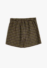 Brune ternede shorts med elastisk talje, prydet med hvide og orange linjer i et gittermønster. Fremstillet af blødt, tekstureret materiale.