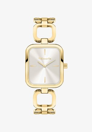 Gouden rechthoekige horloge met een geborsteld zilveren wijzerplaat, met minimale markeringen en een oversized schakels-band. Merkennaam gegraveerd op de wijzerplaat.