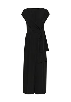 Combinaison noire en tissu doux, avec un design à enfiler à l'avant, des manches courtes et un détail noué à la taille. Silhouette à jambe large.