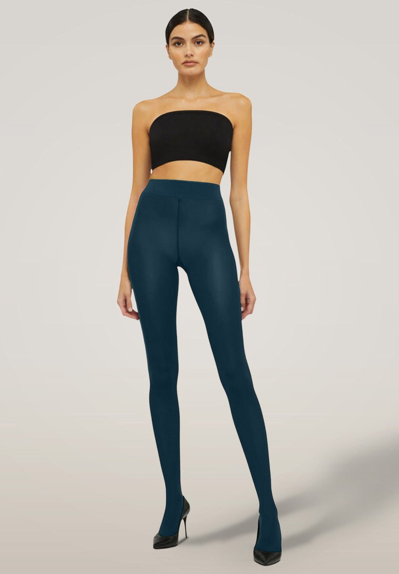 Leggings a vita alta color verde acqua realizzati in materiale elastico, con una texture liscia e un design aderente, abbinati a un crop top nero.