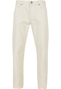 Pantalons en coton beige, à la texture lisse, coupe droite, design à cinq poches et fermeture à bouton métallique à la taille.