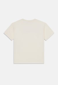 Korte mouwen t-shirt in een licht crèmekleur, gemaakt van zachte stof, met een eenvoudige ronde hals en geen zichtbare patronen of accenten.