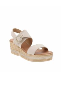 Sandali wedge beige chiaro con doppi cinturini incrociati e una fibbia decorativa. I dettagli in corda naturale sulla suola aggiungono texture.