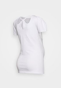 T-shirt branco de mangas curtas com um decote redondo e um pequeno corte em forma de chave na parte de trás. Feita de um tecido leve e suave.