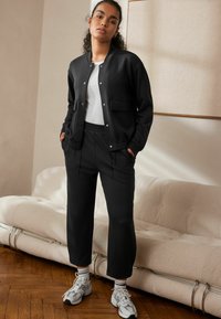 Next REGULAR FIT - Tepláky - black