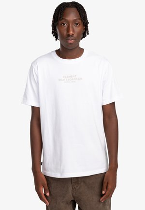 White cotton t-shirt with short sleeves, featuring a light beige printed logo "ELEMENT SKATEBOARD CO. WORLD WIDE" on the front.