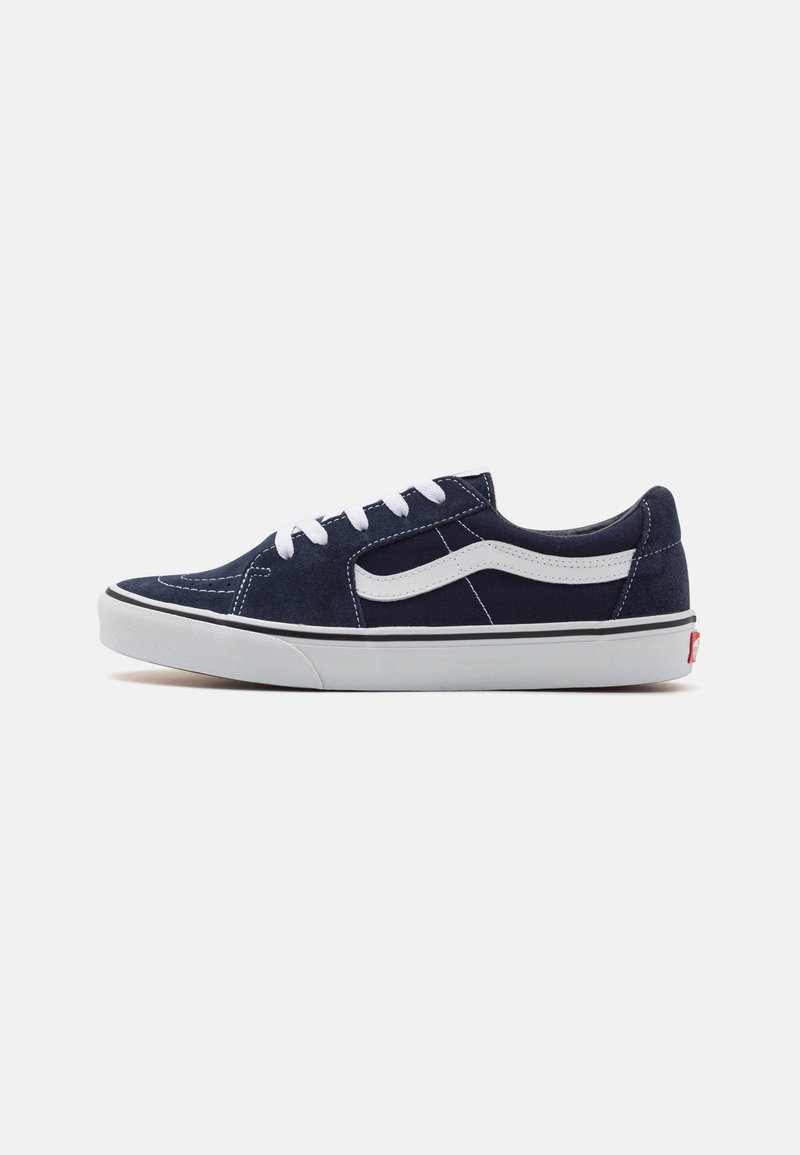 Navy blue suede sneakers with white laces, signature side stripe, and rubber sole. Features stitching detail and low-top design.