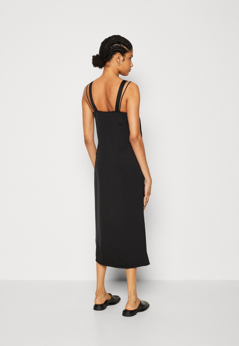 calvin klein black slip dress 1990s Calvin Klein Minimalist Italian Wool Slip Dress  Wayward Collection