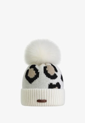 Strickmütze mit Leopardenmuster in Schwarz und Beige vor weißem Hintergrund, mit einem flauschigen weißen Bommel und einem strukturierten, gerippten Bund.