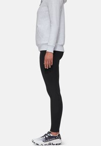 Gray hooded sweatshirt, black leggings, and gray and black athletic shoes shown in side profile. Smooth fabric with casual fit and stitching details.