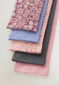 Stack of five folded soft fabrics in pink, gray, floral pink, light blue, and maroon with white floral pattern on a light surface.