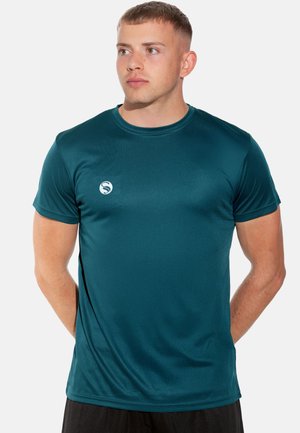 Teal athletic shirt made of smooth, lightweight fabric. Short sleeves and round neckline; features a small logo on the left chest.
