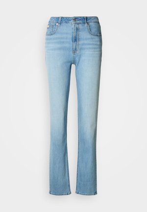 Jeans in denim azzurro chiaro con vita alta, design a gamba dritta e una finitura leggermente sbiadita. Presentano tasche anteriori e una chiusura con zip.