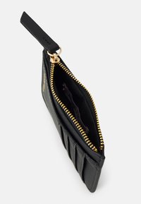 Black zippered wallet made of textured material, featuring a gold zipper, interior card slots, and padded exterior detail.