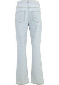Jeanși evazați din denim de culoare bleu deschis, cu un talie înaltă, două buzunare pe spate și detalii de cusătură vizibile. Textură netedă cu croi clasic.
