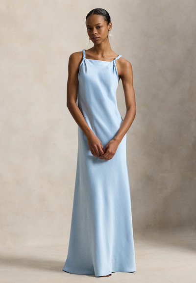 Ανοιχτό μπλε, μίντι αμάνικο φόρεμα με κόμπους στους ώμους. Λείο ύφασμα, εφαρμοστό μπούστο και αέρινη φούστα. Απλός και κομψός σχεδιασμός.