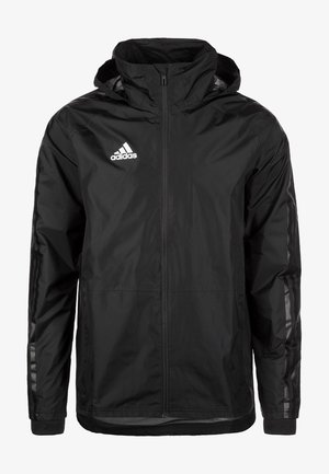 Giacca nera a vento con zip frontale, cappuccio regolabile, strisce laterali riflettenti e logo Adidas sul lato sinistro del petto.