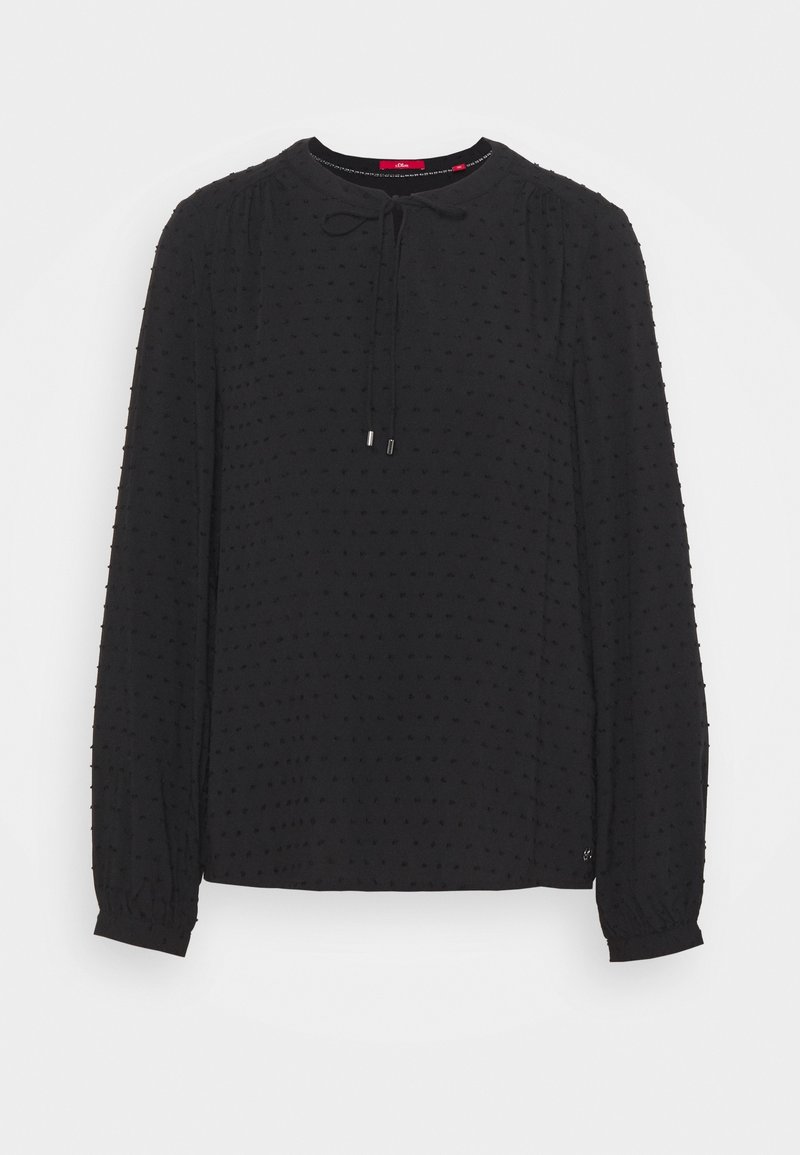 Blusa nera a maniche lunghe con collo rotondo e dettaglio con lacci, caratterizzata da un motivo a pois testurizzati e polsini elasticizzati. Tessuto morbido e leggero.