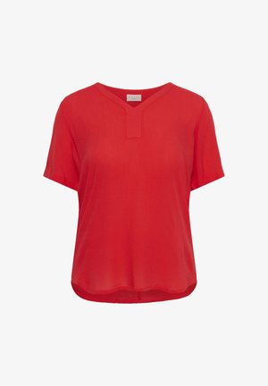 Blusa rossa a maniche corte con tessuto strutturato e piccolo intaglio a V sulla scollatura, con orlo leggermente arrotondato.