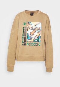 Felpa marrone con vestibilità comoda, caratterizzata da una stampa grafica colorata sulla parte anteriore e polsini a coste. Realizzata in tessuto morbido e strutturato.