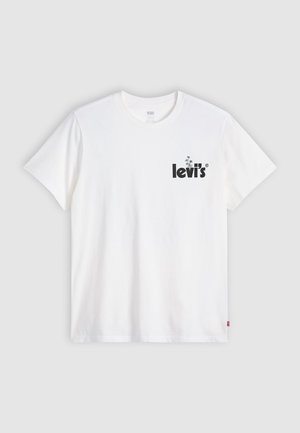 Bijela pamučna majica s kratkim rukavima i okruglim izrezom. Ima crni logotip "levi's" na lijevoj strani prsnog područja. Mekana tekstura.