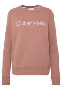 Felpa a maniche lunghe rosa polveroso con il logo bianco "Calvin Klein" centrato sul petto, scollatura rotonda e polsini e orlo a coste.