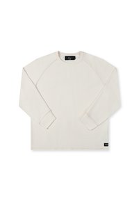 Long-sleeve cream sweatshirt with ribbed texture, raglan sleeves, and a discreet brand tag at the hem. Smooth fabric with minimal seams.