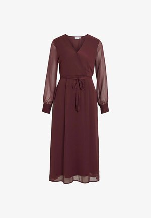 Burgundy wrap dress with a V-neck, long sheer sleeves, and a fabric tie belt at the waist. The skirt is long and flowy.