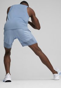 Puma FORM SEAMLESS 7 - Športové šortky - zen blue