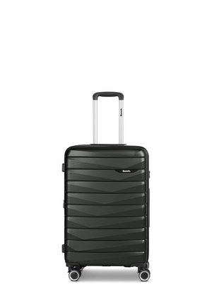 Black hard-shell suitcase with a textured zigzag pattern, retractable handle, and four spinner wheels for easy mobility.