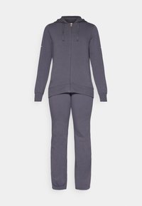 Siva hoodie s patentnim zatvaračem i vezicama, s dugim rukavima i prednjim džepovima, uparen s odgovarajući sivo donje hlače s opuštenim krojem.