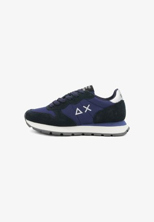 Navy blue and black sneaker with white sole, suede accents, laces, and white triangle and X logo on side.