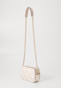 Beige structured handbag with white logo pattern, gold chain strap, and leather top handle. Zipper closure with a rectangular shape.