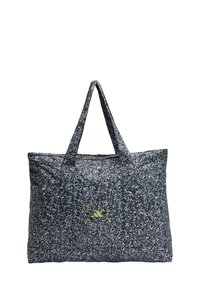 Large tote bag made of textured black and white speckled fabric with two sturdy handles; features a green logo accent.