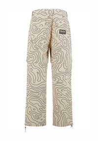 Beige cargo pants with black contour line patterns, featuring large side pockets and drawstring hems. Back logo patch included.