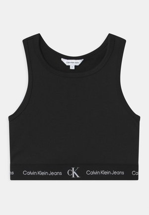 Černý bavlněný crop top s kulatým výstřihem a širokými ramínky. Obsahuje značkový elastický pásek s nápisem "Calvin Klein Jeans" v bílém písmu.