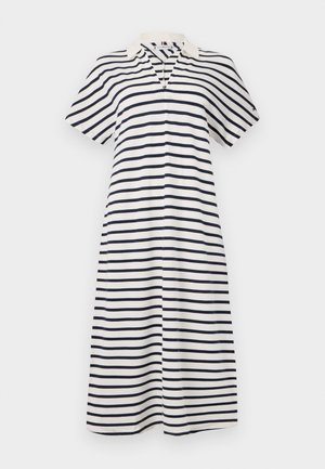 Juostuota suknelė su trumpomis rankovėmis, apykaklės iškirpte ir kelių ilgio sijonu. Medžiaga yra švelni; spalvos - baltos su tamsiai mėlynomis juostomis.