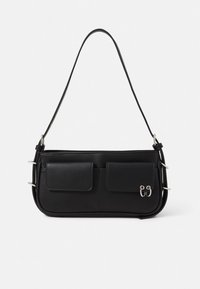 Black leather handbag with a slim profile, two front pockets, silver hardware accents, and a single adjustable shoulder strap.