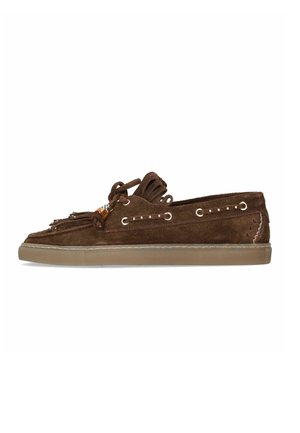 Brown suede slip-on loafer with rubber sole, decorative fringe, leather laces, and metal eyelets along the sides.