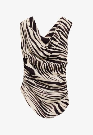 Zebra-striped sleeveless top in cream and black. Features draped neckline and gathered side detail. Made of lightweight fabric.