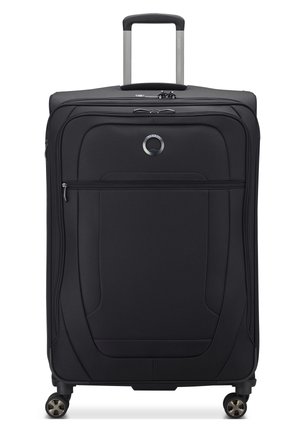 Black fabric suitcase with a smooth texture, multiple zippered compartments, grey telescopic handle, and four rotating wheels for mobility.