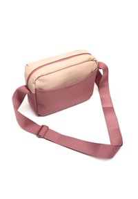 Borsa a tracolla in rosa chiaro e rosa polveroso, realizzata in materiale sintetico liscio. Presenta una chiusura con zip e una tracolla regolabile.
