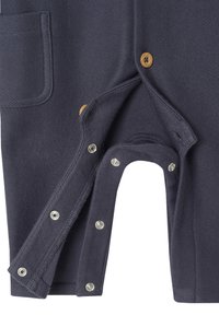 Dark navy baby romper with snap buttons open at the crotch and wooden buttons on the front placket, showing soft textured fabric.