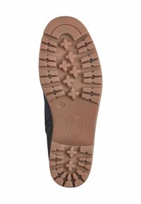 Semelle extérieure noire de chaussure avec un motif de semelle en caoutchouc présentant des étoiles et des rainures, conçue pour l'adhérence et la durabilité. Marquée avec la taille 37.
