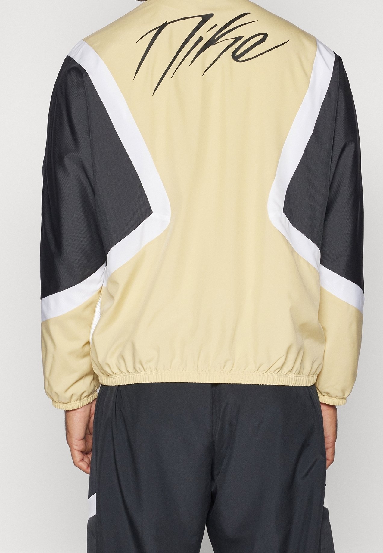 white and gold nike windbreaker mens