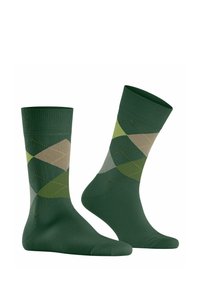 Zielone bawełniane skarpetki z wzorem w romby w różnych odcieniach zieleni i beżu, z kontrastującym żółtym szyciem na wzorze.