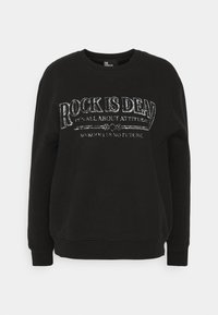 Felpa nera con scollo rotondo, maniche lunghe e testo in argento metallico che recita "ROCK È MORTO" con frasi aggiuntive sottostanti.