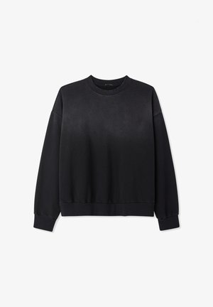 Felpa nera a maniche lunghe con collo rotondo, realizzata in un tessuto liscio, con polsini e orlo a costine, e una vestibilità rilassata con design a spalla cadente.