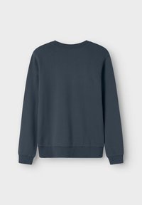 Mörkgrå sweatshirt med rund hals, långa ärmar och ribbade muddkanter. Slät textur, avslappnad design och en enfärgad nyans utan utsmyckningar.