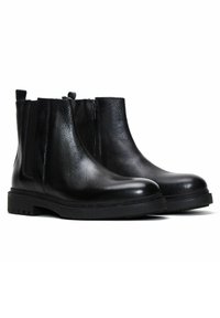 Bottes noires en cuir à la cheville avec une finition texturée, bout rond, zips latéraux et semelles en caoutchouc dotées d'un motif antidérapant.